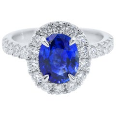 Oval Sapphire Halo Set Diamond Engagement Ring 18 Karat White Gold