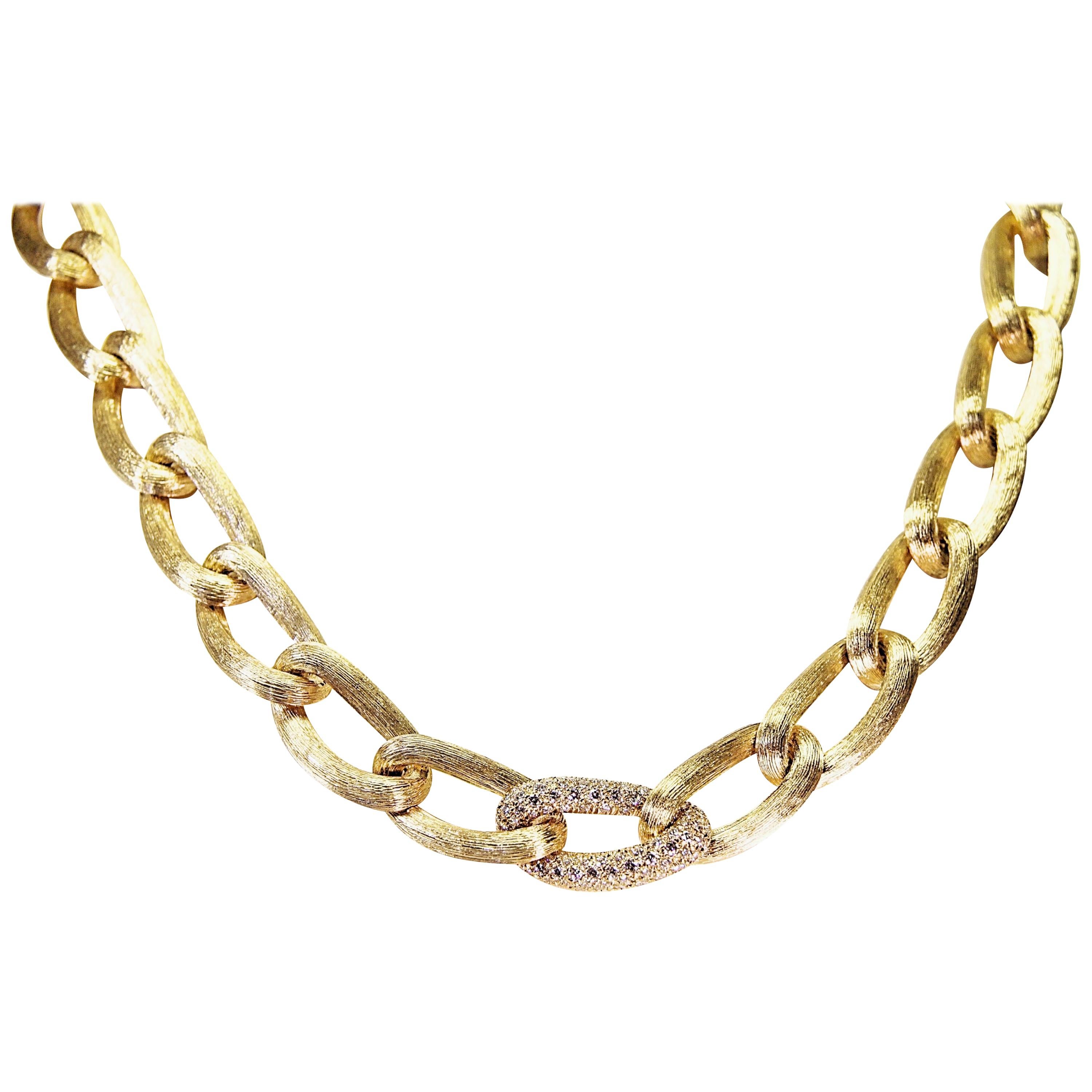 This stunning hand crafted 18 karat yellow gold necklace was designed by Henry Dunay.  The necklace consists of 26 large interlocking sabi designed links and one link has pave diamonds.  The one diamond link has 123 round brilliant cut diamonds that