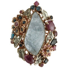 Vintage Central Aquamarine Diamonds, Rubies, Blue Sapphires 9 Karat Gold and Silver Ring