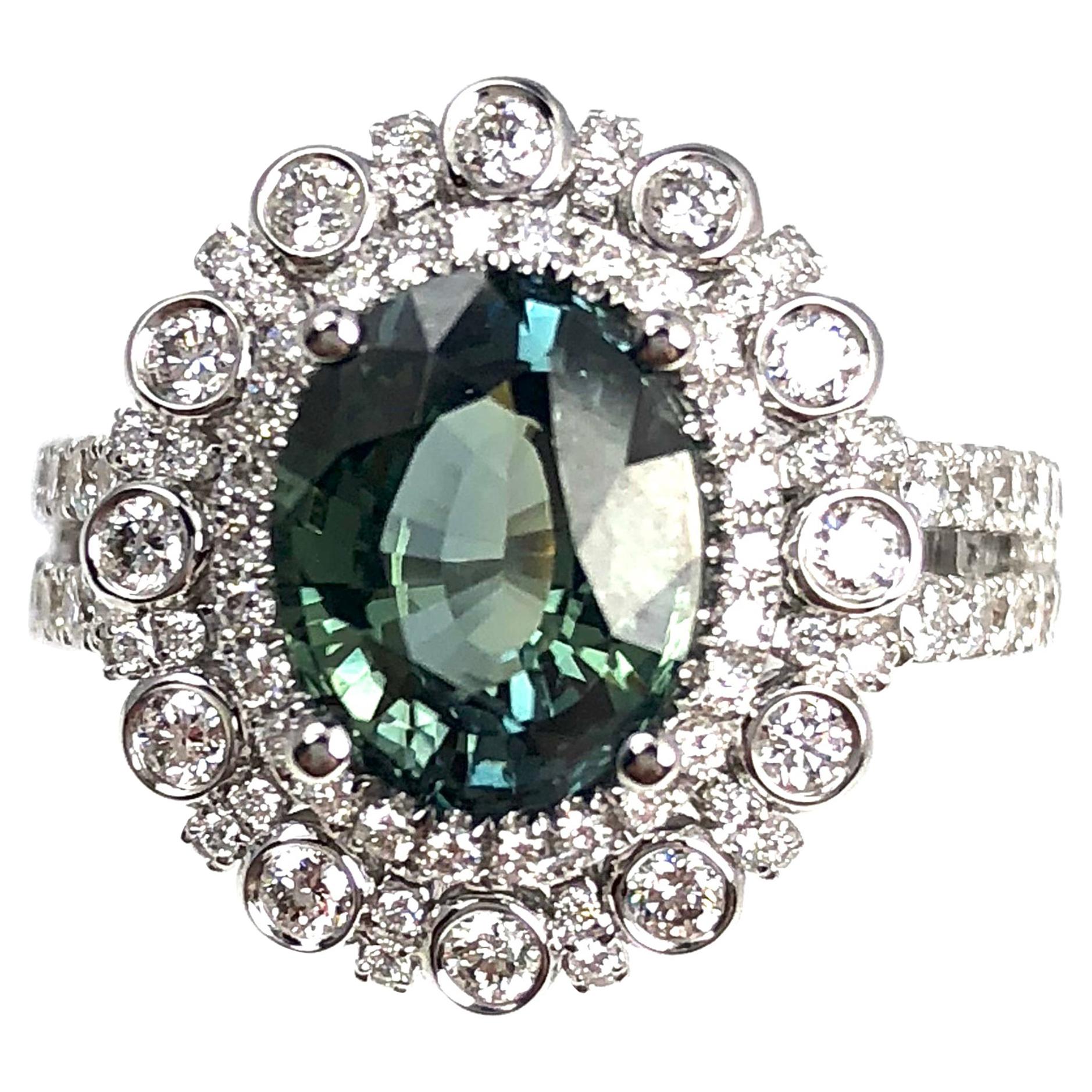 2.60 Carat Oval Cut Green Sapphire and 1.03 Carat Diamond Ring in 18 Karat Gold