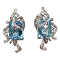 White Round Brilliant Diamond And Blue Topaz Earring Studs In 18K White Gold 