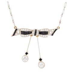 Art Deco Diamond and Onyx Bow Necklace, circa 1920s