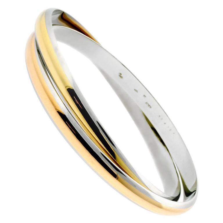 Cartier Gold-Edelstahl-Armreif mit ineinandergreifendem Cartier