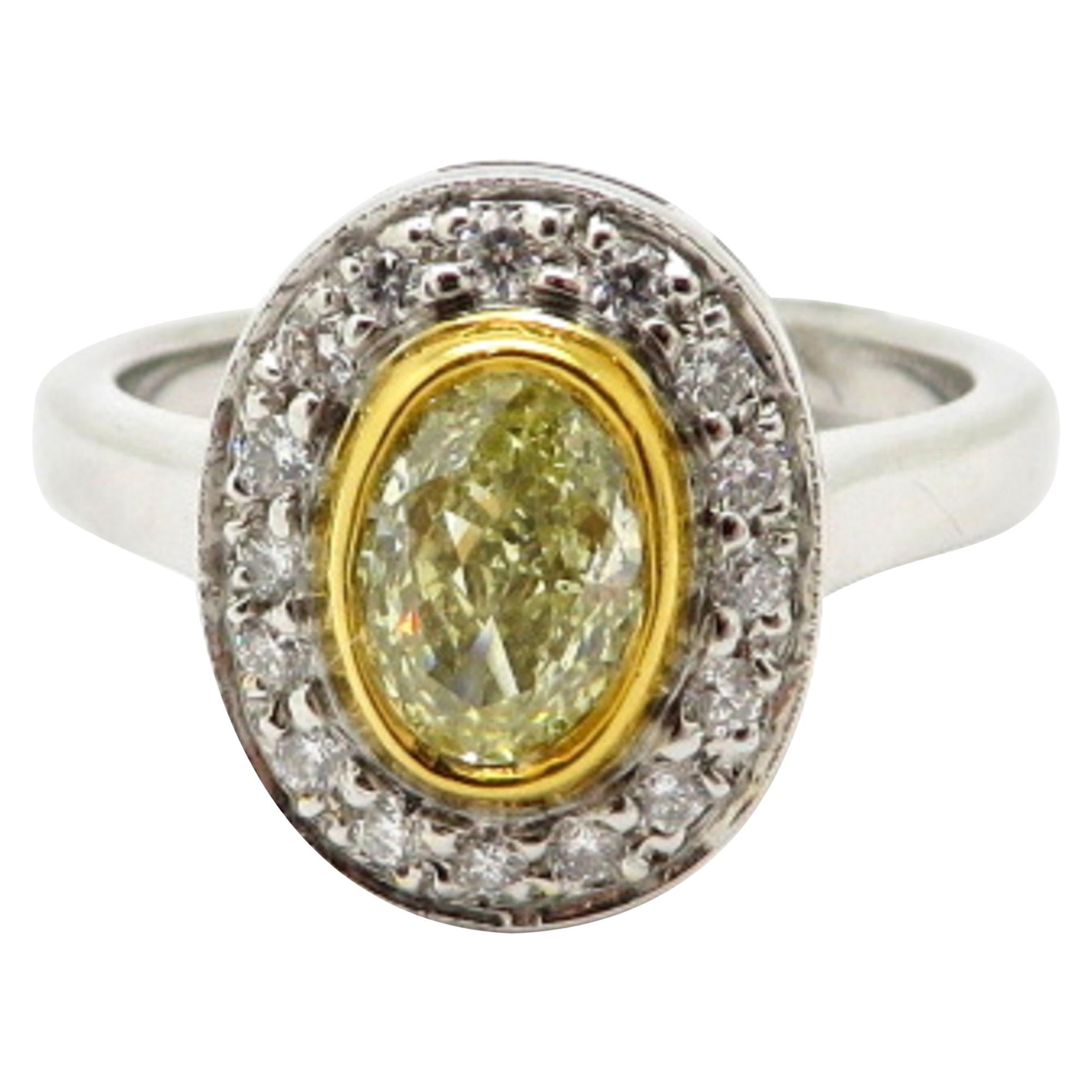 Estate Yellow Oval Diamond Halo 18 Karat Yellow Gold and Platinum Ring For Sale