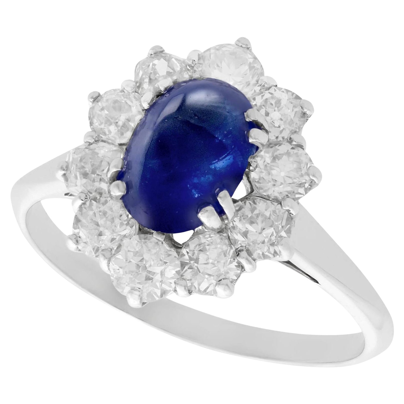 1940s 2.17 Carat Cabochon Cut Sapphire and Diamond Gold Cluster Ring For Sale