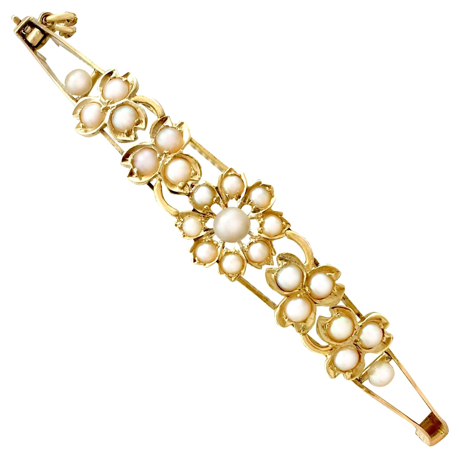 Bracelet jonc ancien en or jaune et perles de rocaille des années 1890 en vente