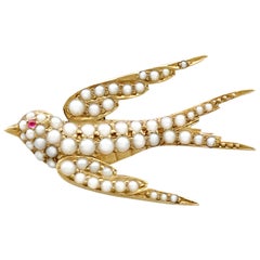 1890s Antique Pearl and Ruby Yellow Gold Swallow Brooch