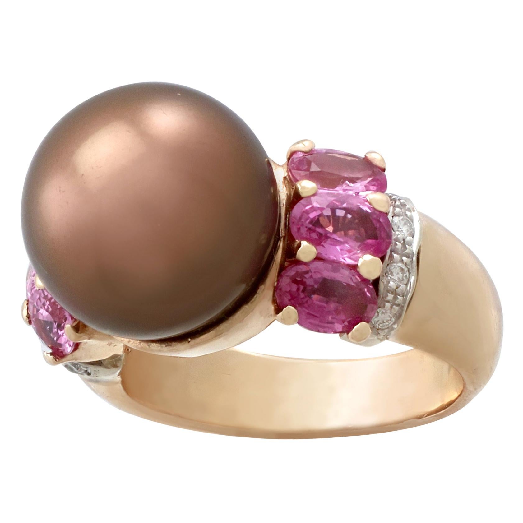 A stunning vintage chocolate pearl and 2.95Ct pink sapphire, 0.08Ct diamond and 18k gold dress ring; part of our diverse vintage jewelry collections.

This stunning, fine and impressive pearl and pink sapphire ring has been crafted in 18k yellow