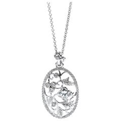 Pendentif à fleur en or blanc 18 carats avec nœud papillon et diamants de 0,87 carat au total