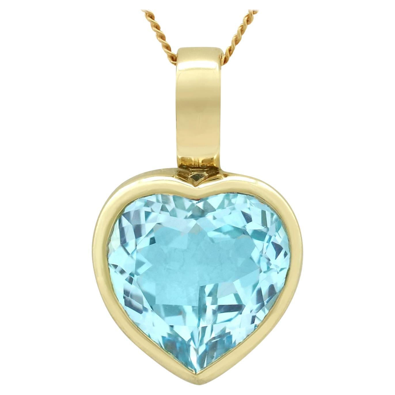 Vintage 1990s 13.50 Carat Blue Topaz and Yellow Gold Heart Pendant For Sale