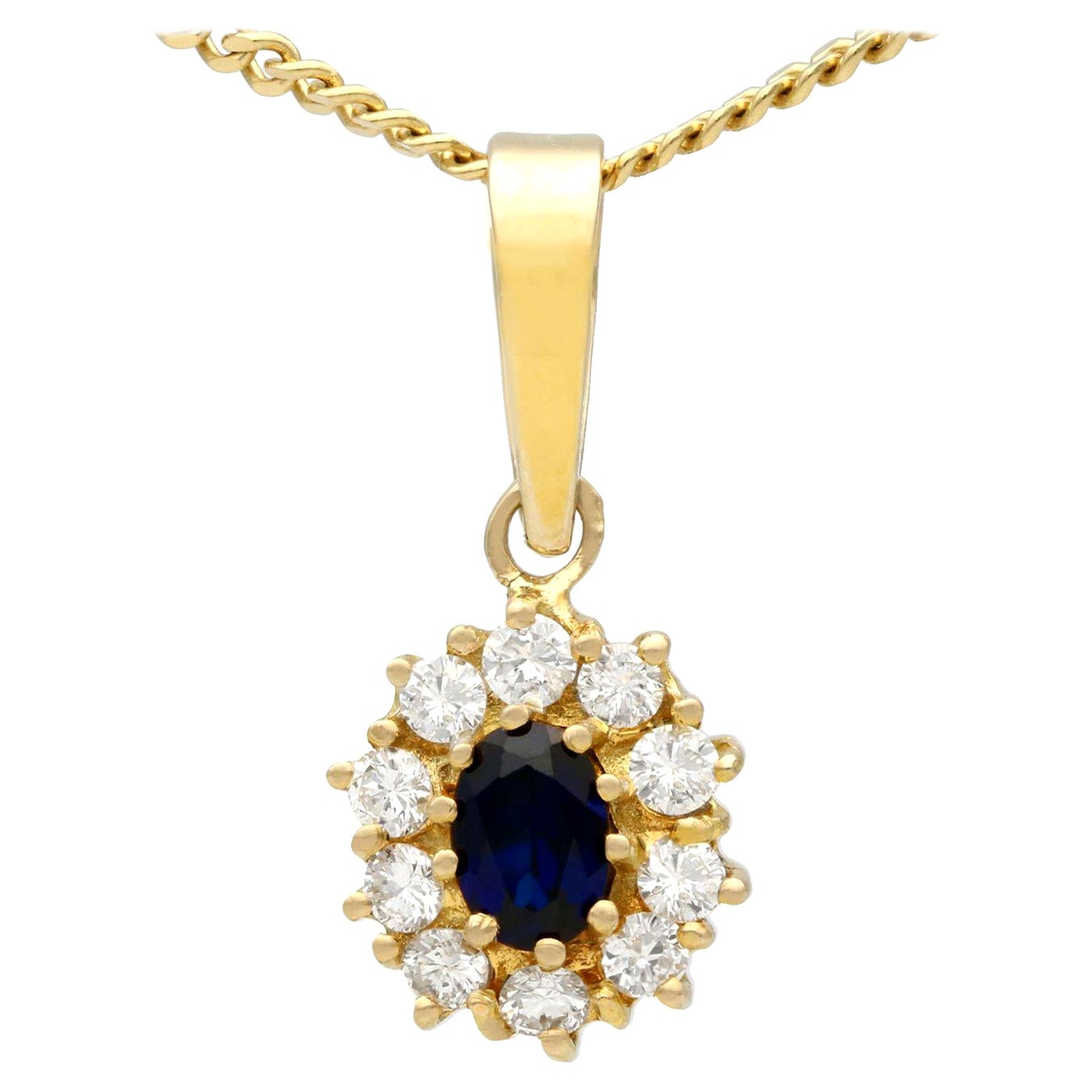 Vintage 1980s Oval Cut Sapphire and Diamond Yellow Gold Cluster Pendant For Sale