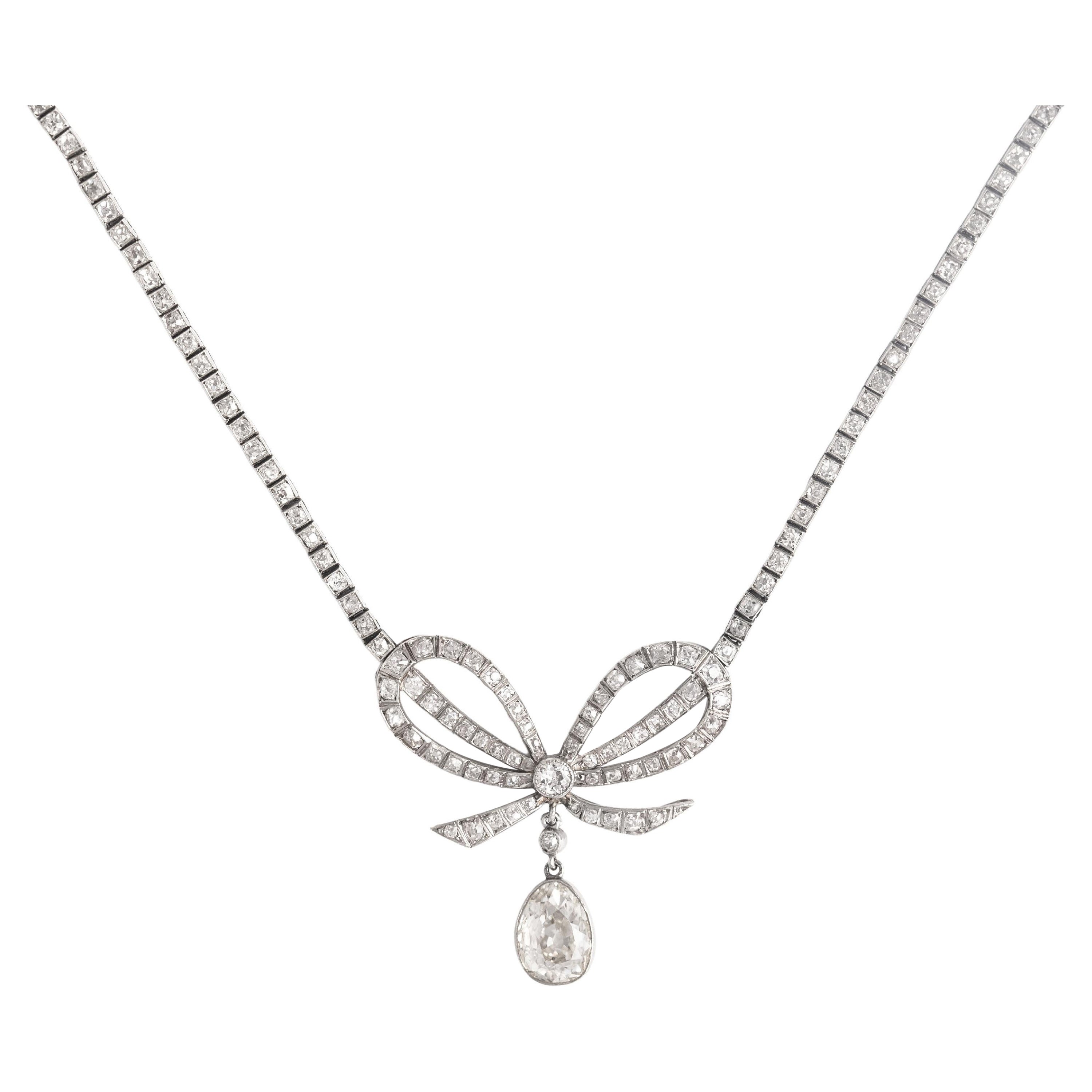 Belle Époque Diamond Platinum Bow Pendant Necklace For Sale