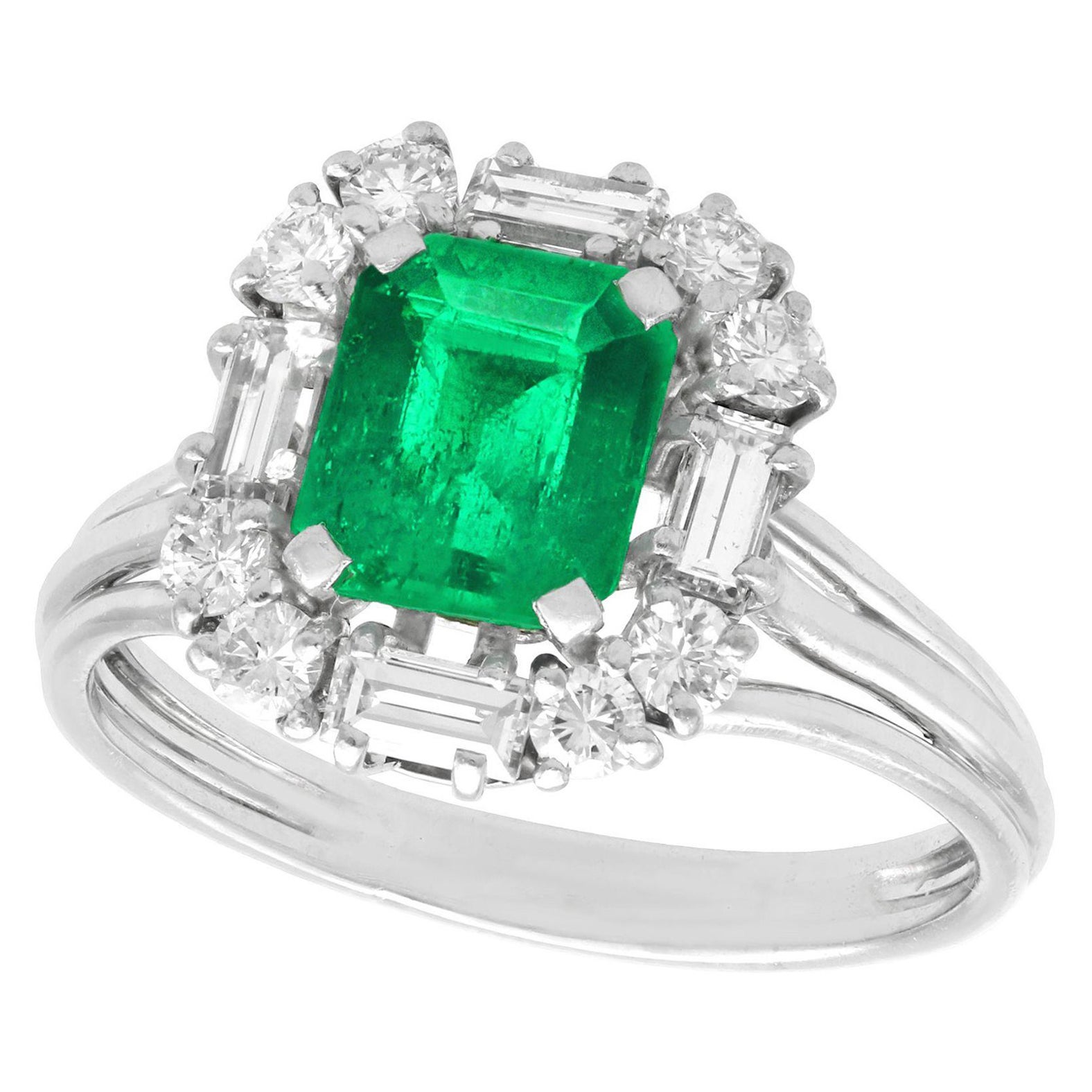 1970s 1.43 Carat Emerald and Diamond Platinum Cluster Ring