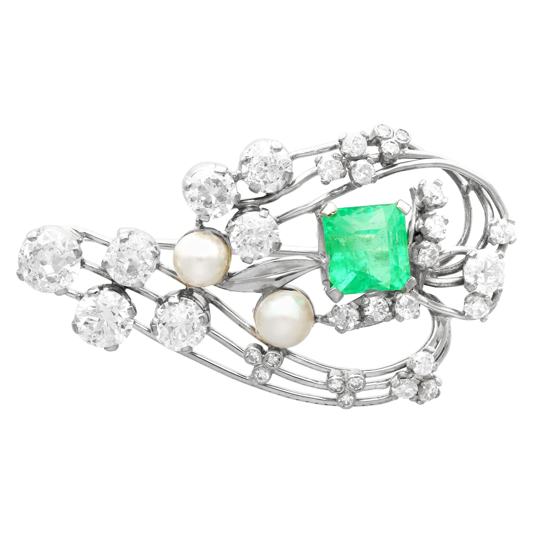 1920s Antique 3.19 Carat Emerald 4.38 Carat Diamond and Pearl Gold Brooch For Sale