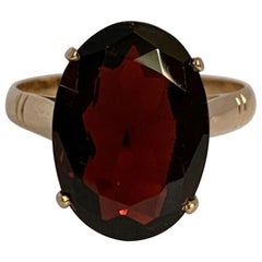 Oval Garnet Set in 14 Karat Yellow Gold Ring