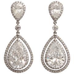 Regal Large Pear Shaped Diamond Dangling Earrings