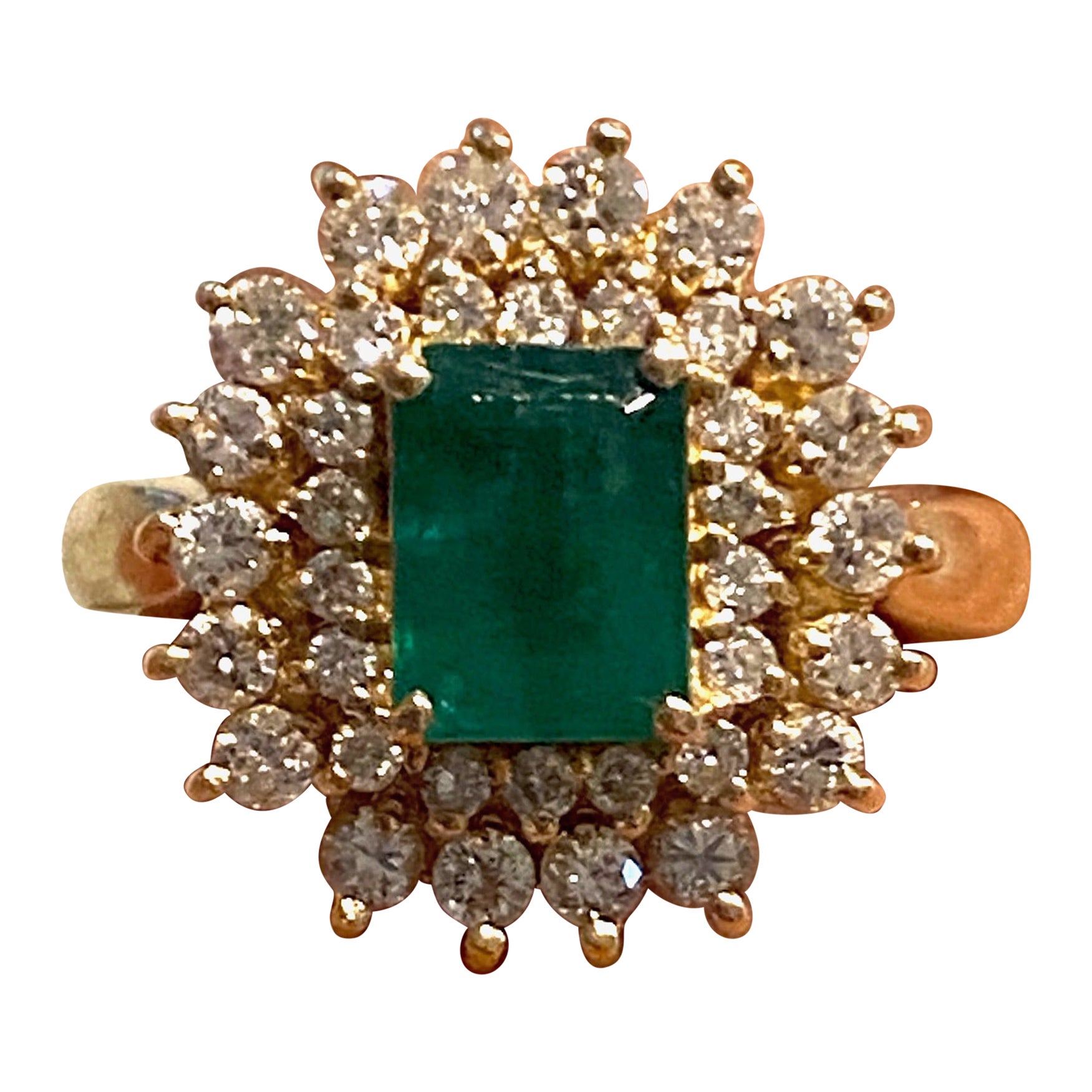 Colombian Emerald, 3 Carat total weight Diamond Ring
The ring features a center Emerald Cut Emerald of Colombian origin measuring 8 x 6 mm in diameter and weighing approximately 1.75 carats. The color green is consistent and beautiful and shows as