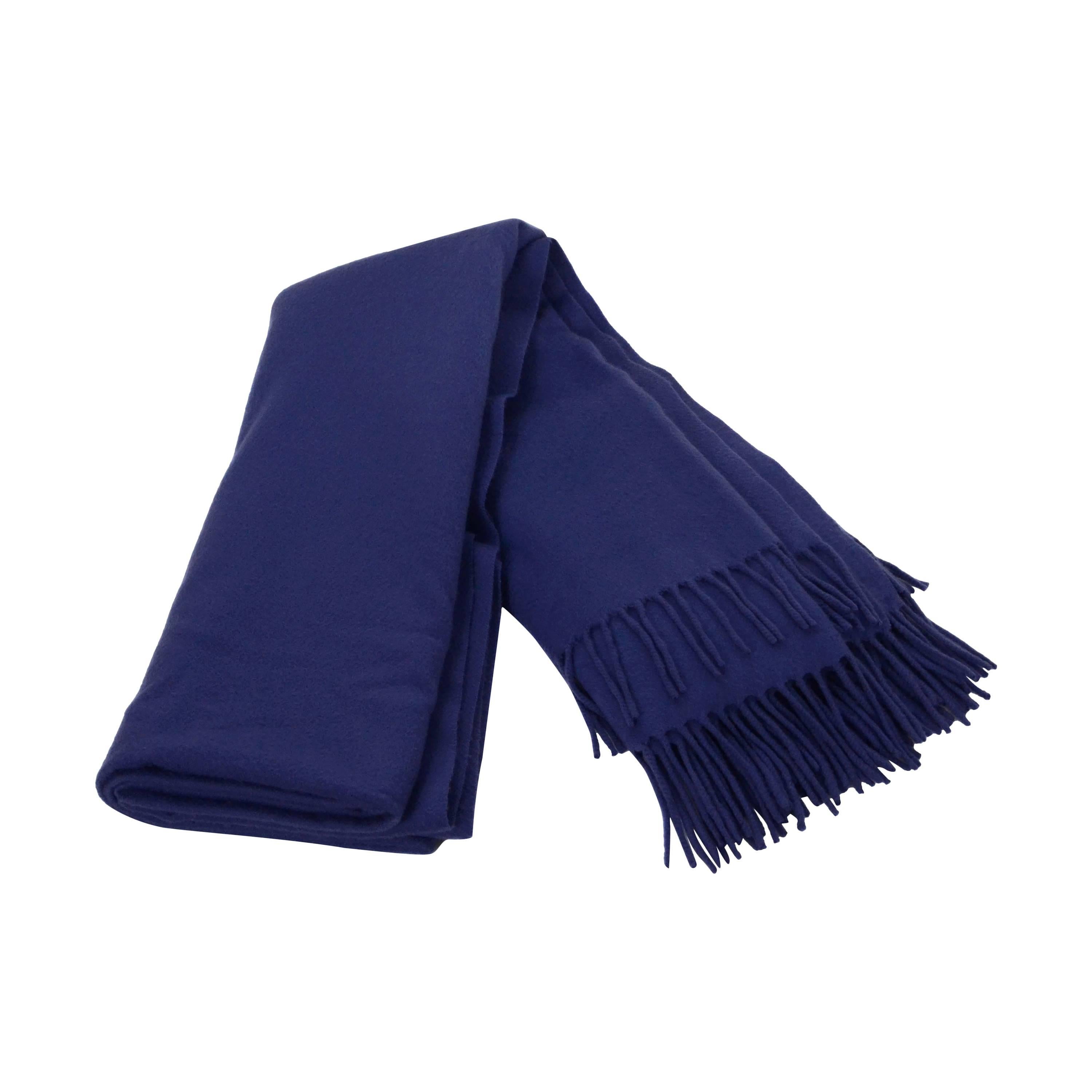 Hermes Indigo Cashmere Fringe Blanket 
Features Hermes logo stitched on front bottom corner

Made In: Italy
Color: Indigo
Composition: 100% Cashmere
Overall Condition: Excellent pre-owned condition

Measurements:
Length: 84" (including