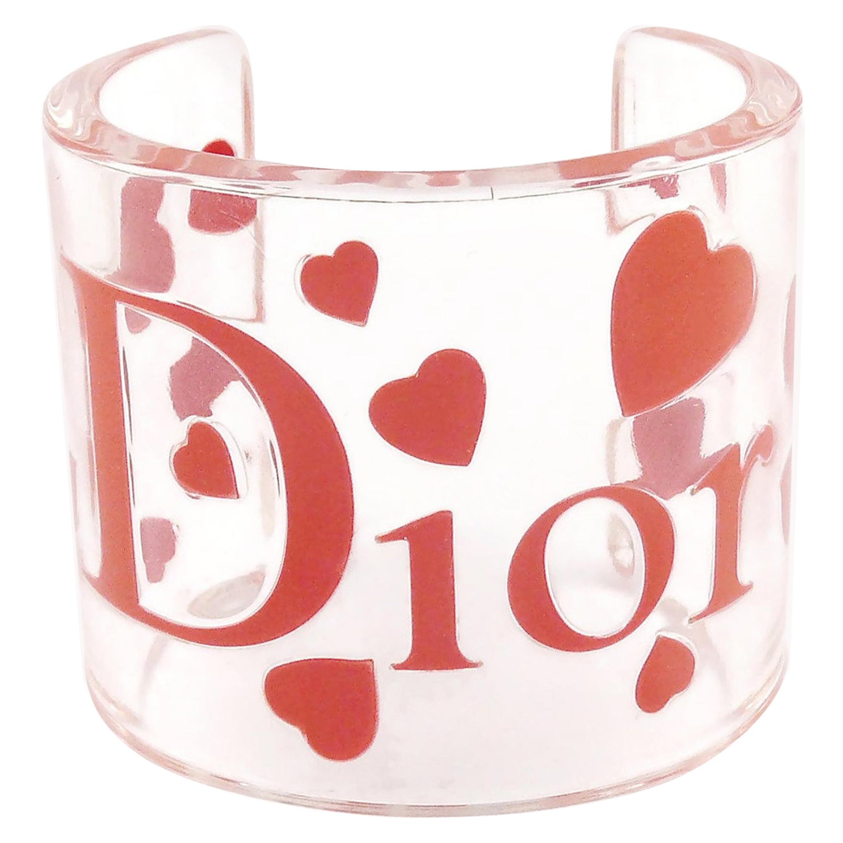 CHRISTIAN DIOR Manschettenarmband aus klarem Harz mit rosa Herzen und Logo im Angebot