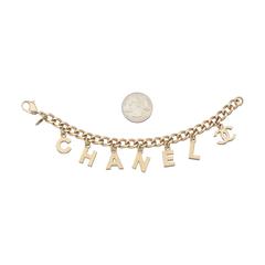 2004 Chanel Gold Tone Metal "C-H-A-N-E-L" & CC Logo Chain-LInked Charm Bracelet