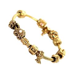 Used Pandora Gold 8 Piece Diamond Embellished Charm Bracelet