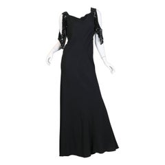 Schwarzes, schräg geschnittenes Kleid aus Viskose-Krepp aus den 1930er Jahren mit Celluloid-Pailletten und auffälligen Ärmeln