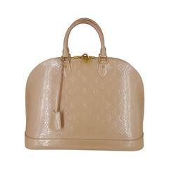 Louis Vuitton Alma GM in Beige Vernis With Gold Hardware.