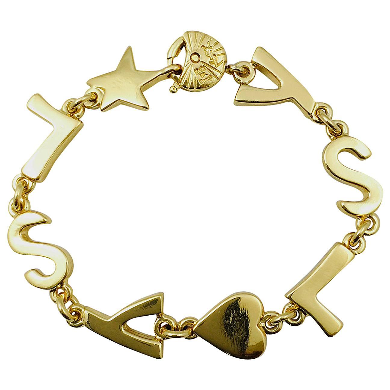 New Vintage Yves Saint Laurent Gold Tone Initial Bracelet  For Sale