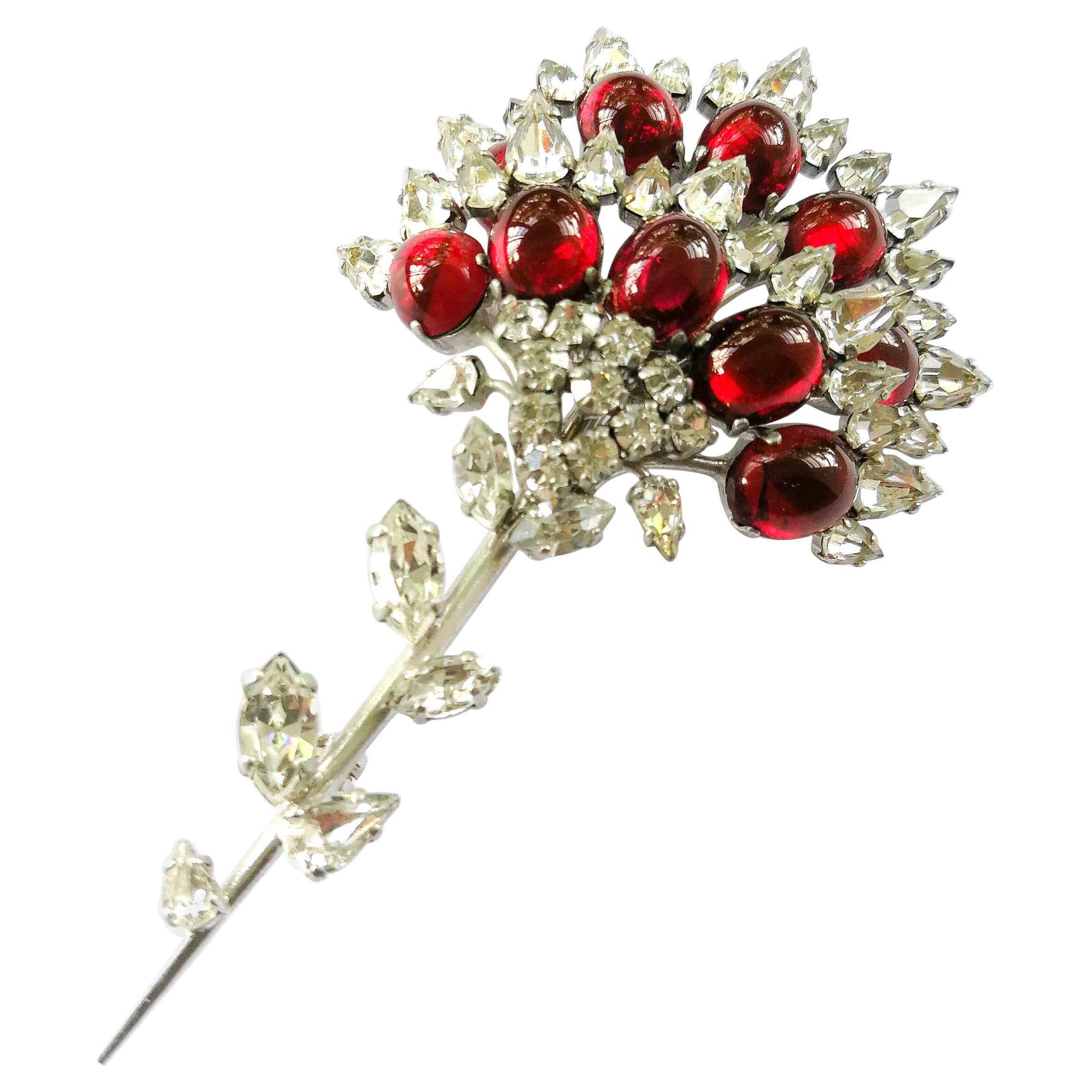 A large paste and cabuchon brooch, Christian Dior, 1960.