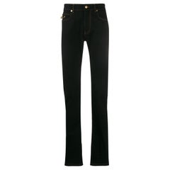 Versace Mens FW19 Black Denim Jeans with Gold-Tone Safety Pin Size 44