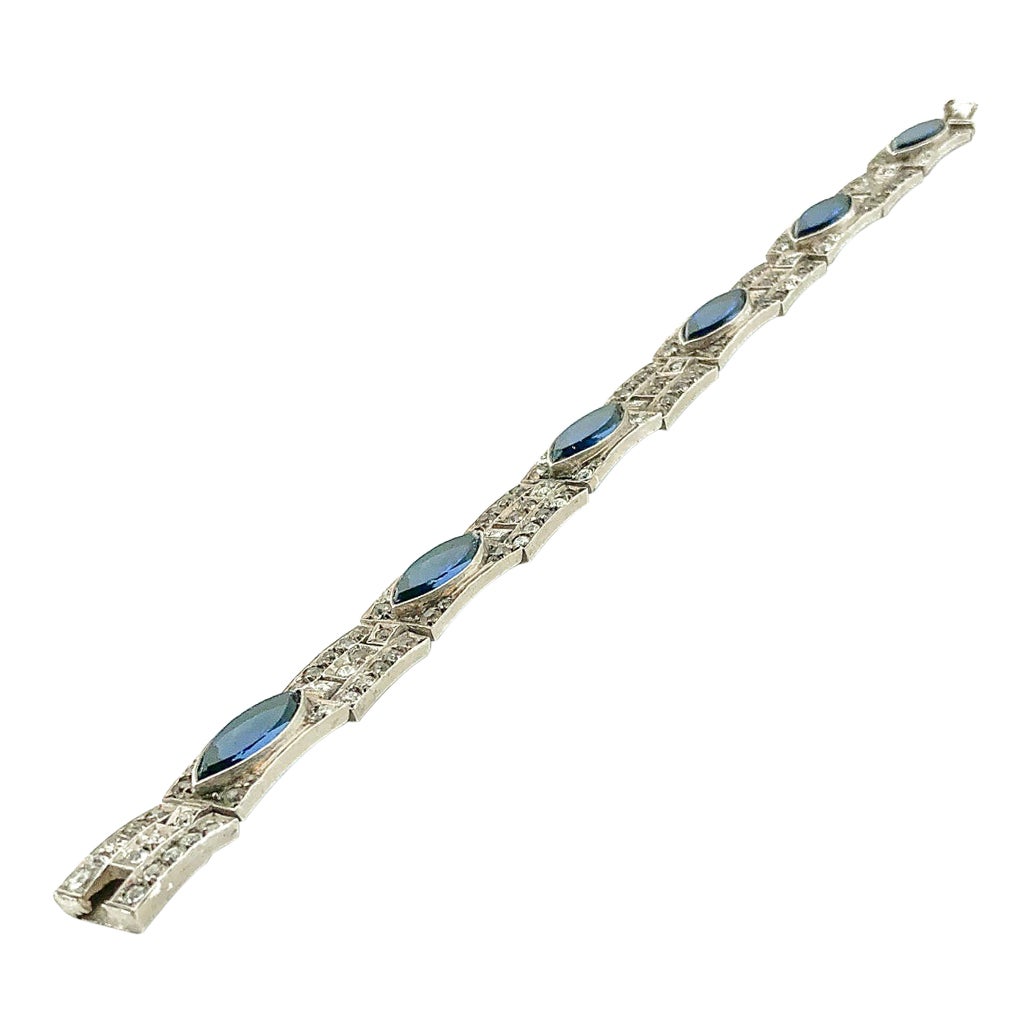 An exquisite original Antique Art Deco Paste Bracelet made in Europe around 1920. Crafted in high quality 935 sterling silver and set with flat-top marquise and round paste glass stones. In very good vintage condition for its age. Just a small chip