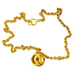 1980s Chanel Gold Toned Long Chain Necklace with CC Resin Ball Charm