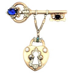 Coro Craft brooch in the shape of a key with attached lock sterling gold plated