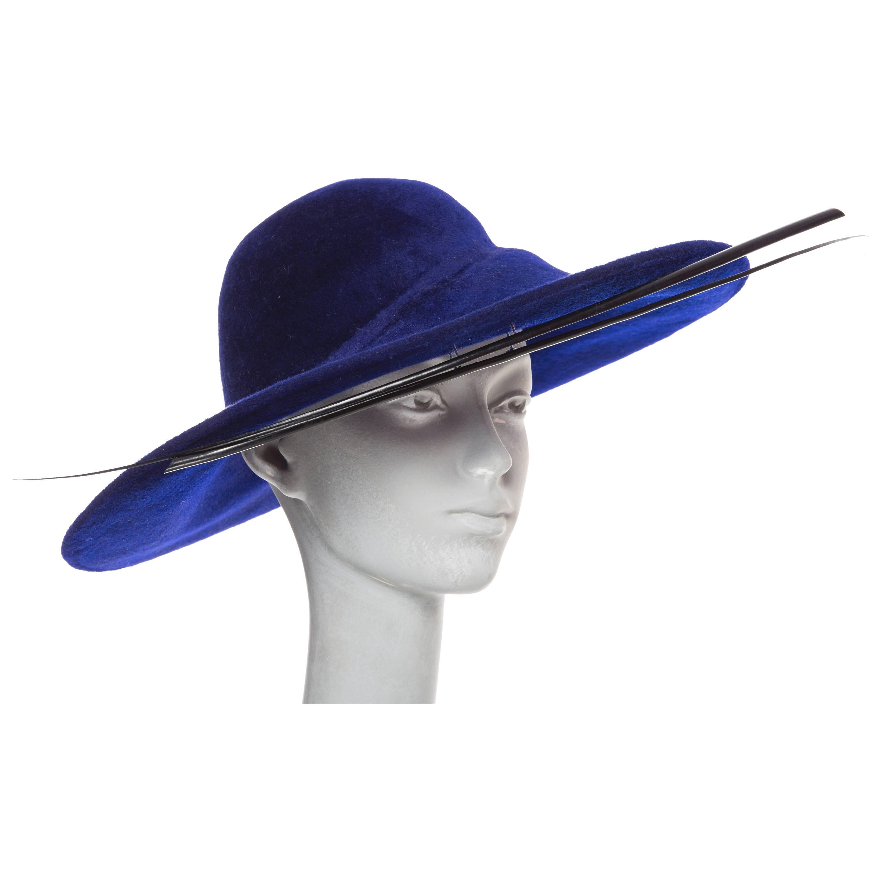 Phillip Treacy indigo wool felt hat with hat box.

Circumference 20”, Brim 5”