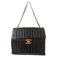 Vintage Chanel black leather gold hardware CC logo shoulder bag