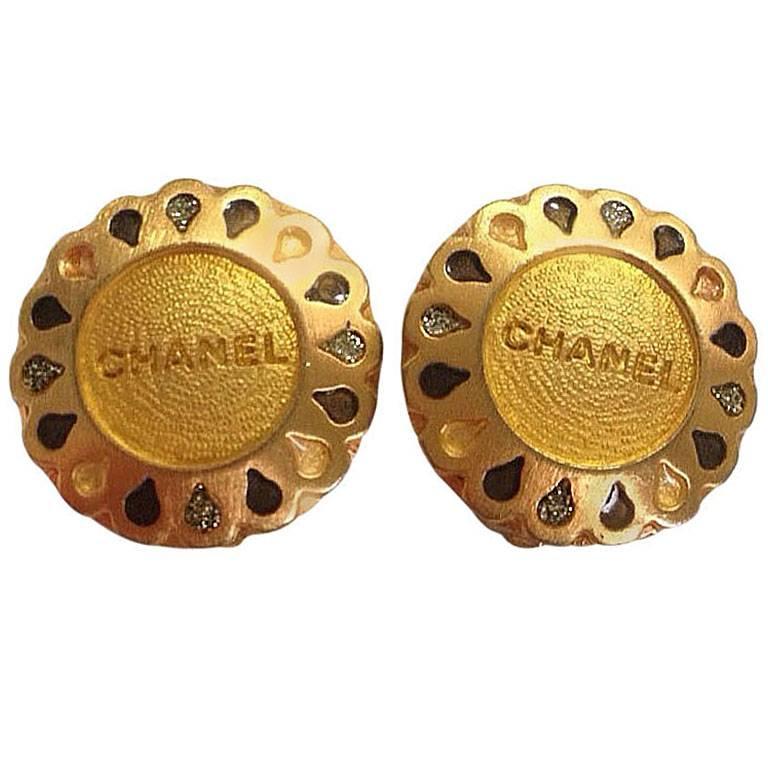1990s Vintage CHANEL gold tone teardrop petal motif flower shape logo earrings. 
