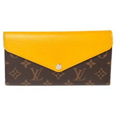 Louis Vuitton Brieftasche Marie-Lou aus Segeltuch und Epi-Leder