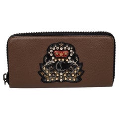 Christian Louboutin Panettone Brieftasche aus braunem Leder mit Reißverschluss