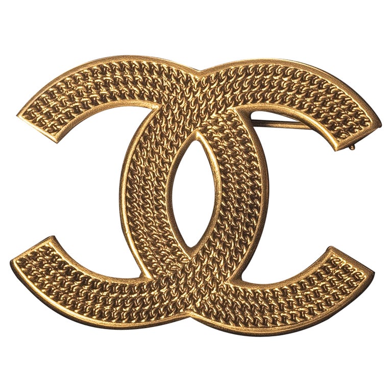 Sold at Auction: CHANEL, LARGE Chanel CC Logo Gold/Black Brooch