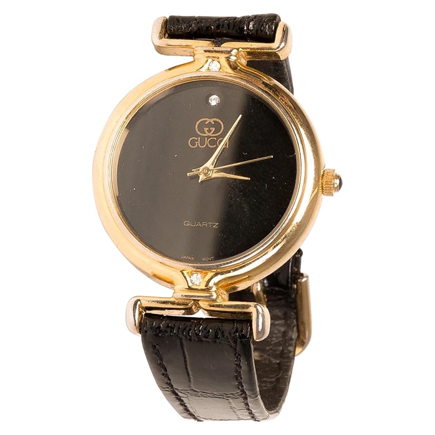 Gucci Montre Vintage Noir/Doré sur 1stDibs