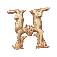 Hermès Doe and Dog Forming an H Brooch in Golden Metal 