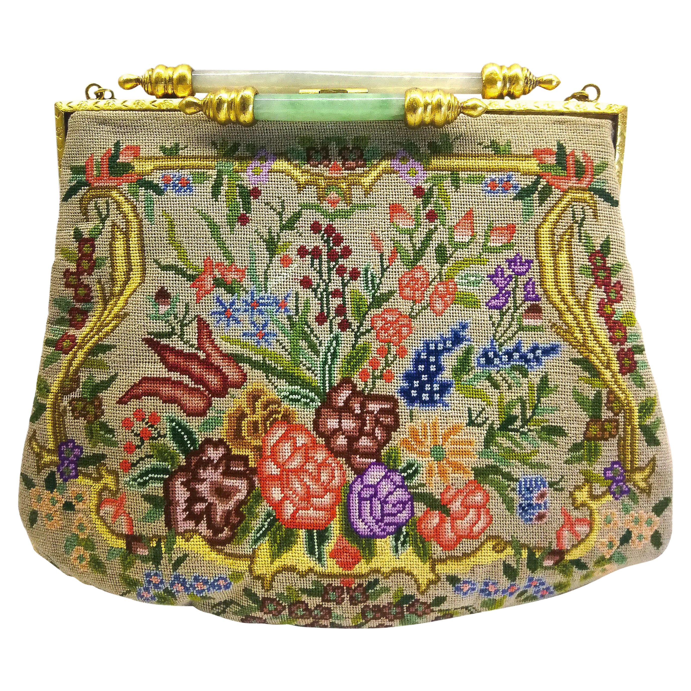 An exquisite Art Deco petit point bag, with a double jade bar clasp, 1920s.
