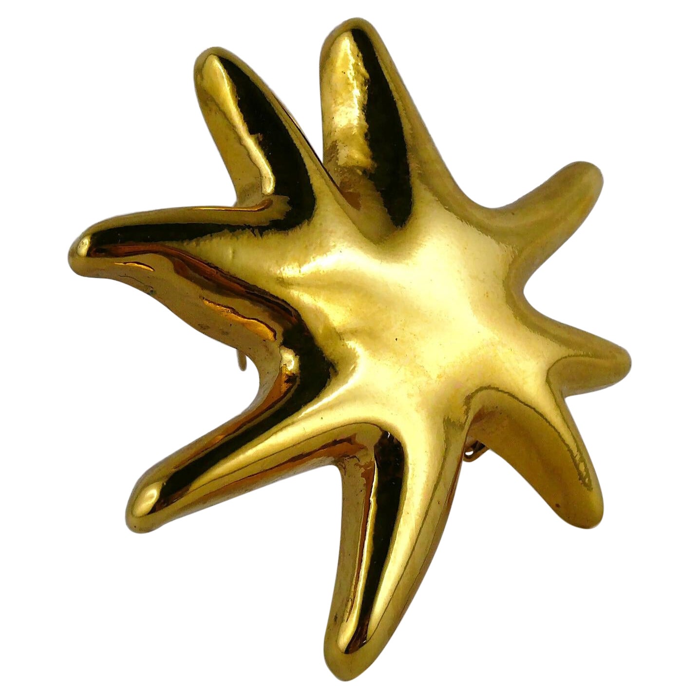 Christian Lacroix Vintage Gold Toned Resin Iconic Starburst Brooch For Sale