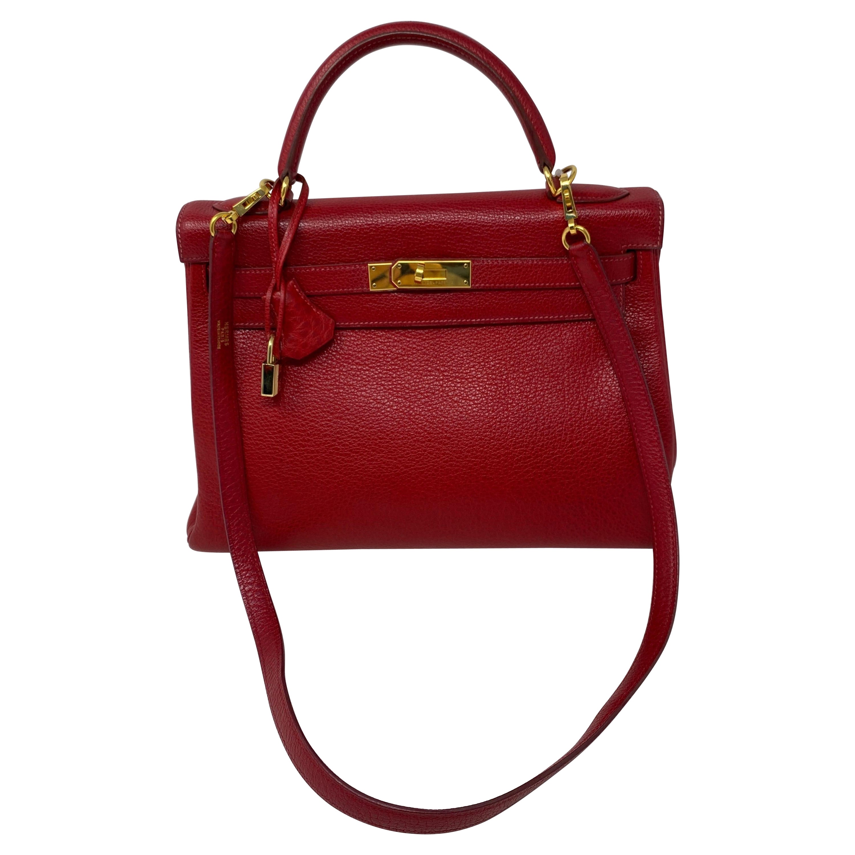 Hermes Kelly 32 Rouge Casaque Bag. Smaller size 32 Kelly. Gold hardware. Good condition. Light dark spot on top left side of bag. Not noticeable but is there. The clochette and keys lays nicely on that spot. Beautiful deep red color. Gorgeous