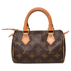 Louis Vuitton Mini Speedy Monogram avec sac à poussière