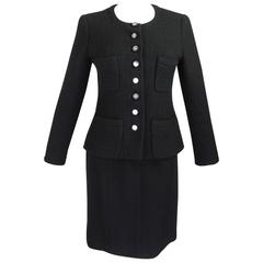1990s CHANEL Classic Black Bouclé Skirt Suit with Mirrored Logo Buttons