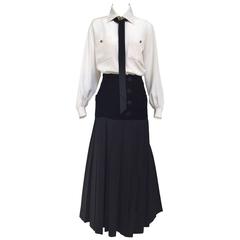 Yves Saint Laurent creme silk blouse and black skirt