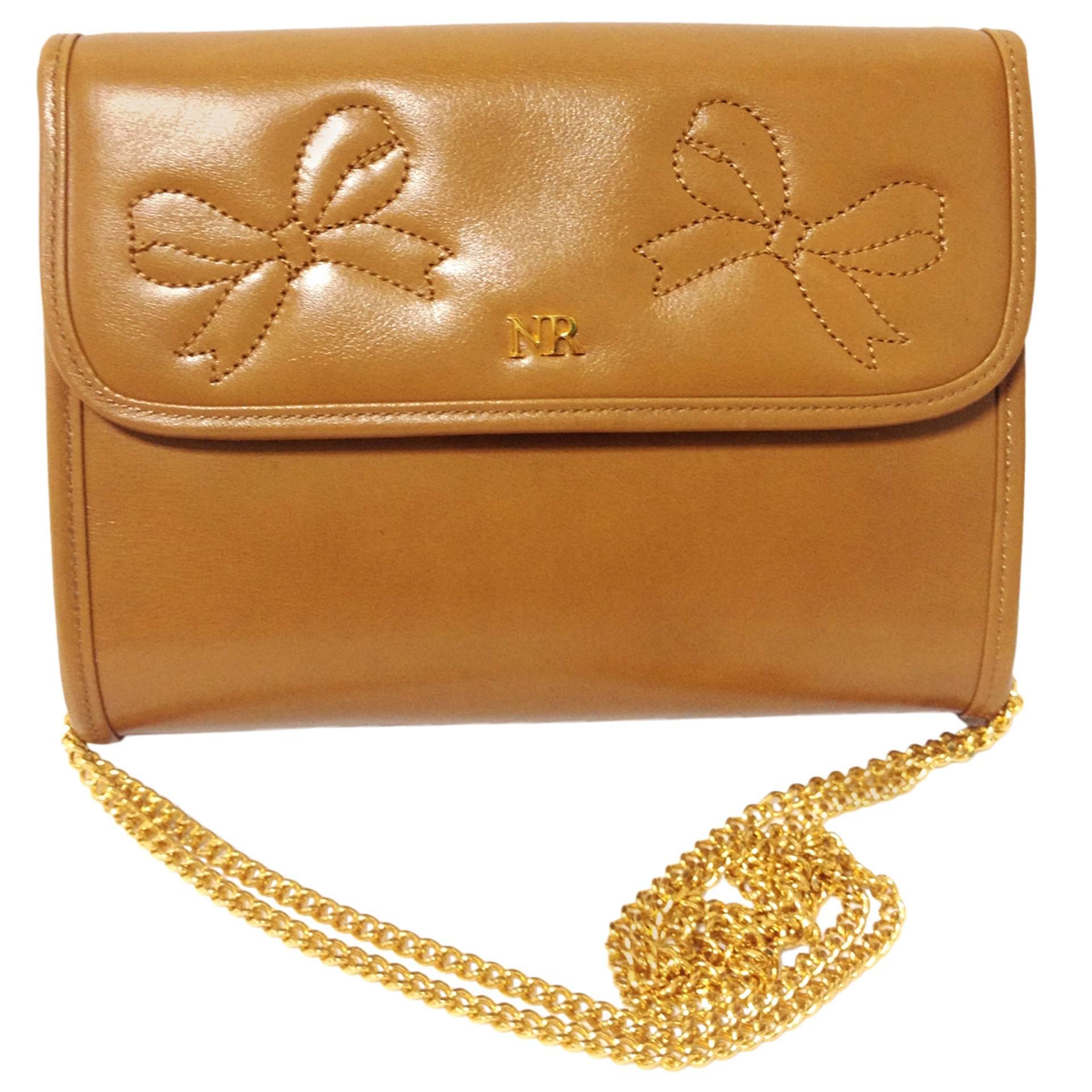 Vintage Nina Ricci tanned brown leather mini clutch shoulder bag with gold chain For Sale