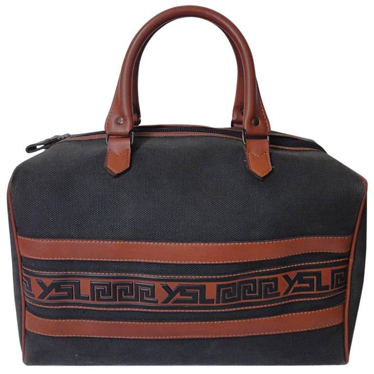 Vintage Yves Saint Laurent charcoal grey canvas and brown leather mini duffle ba For Sale at