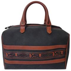 Retro Yves Saint Laurent charcoal grey canvas and brown leather mini duffle ba